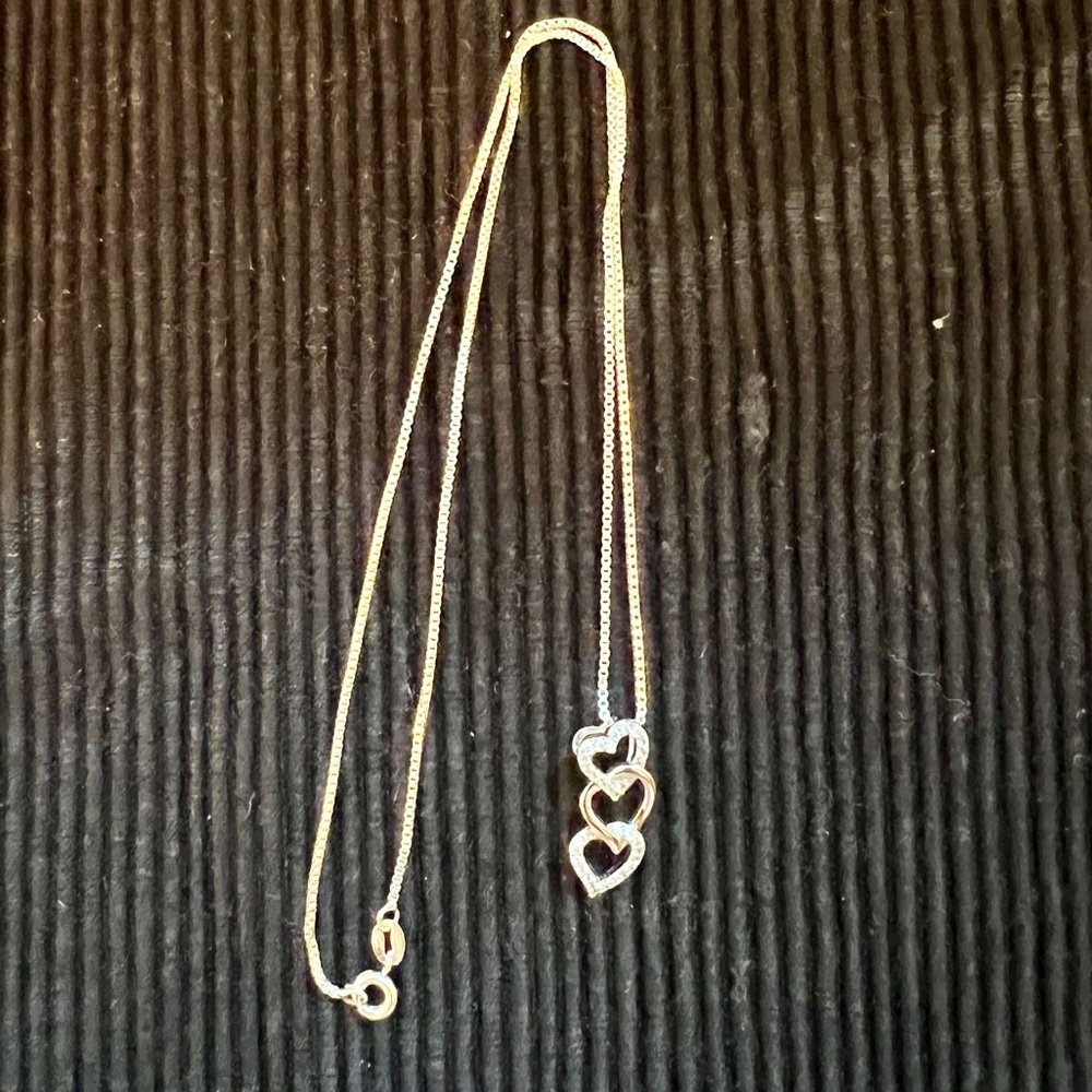 Necklace with triple heart pendant